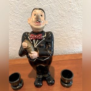 Vintage cocktail shaker with shot glasses